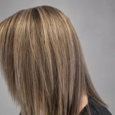 Balayage colour on sleek, straight mid-length hair